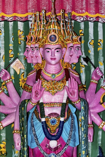 Colourful depiction of a multi-headed deity with detailed decorations, the Seema Malaka temple with the Buddha statues in Colombo Sri Lanka