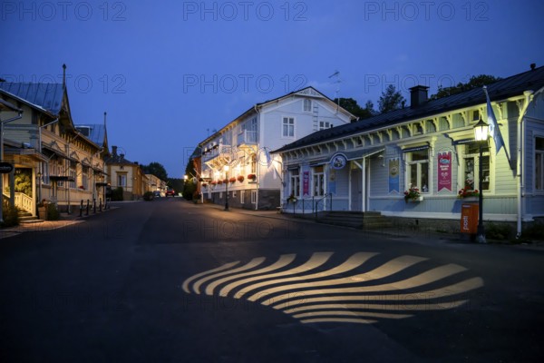 Street scene in the old town of Naantali, A night view of a quiet street with illuminated buildings, Naanatali, Varsinais-Suomi, Finland
