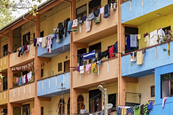 Apartment building with colorful facades and laundry hanging on the balconies, apartment building with balconies in Colombo Sri Lanka
