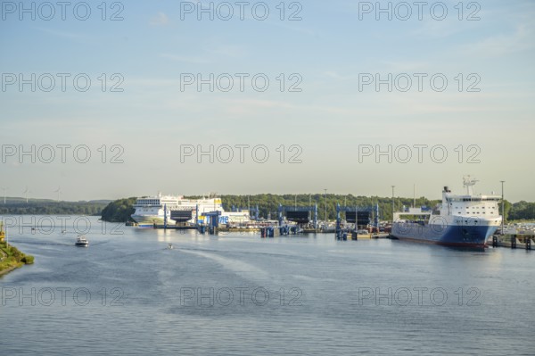 Large ferries and ships are moored at the port of Scandinavia Quay in Travemünde with deep blue water, Lübeck-Travemünde, Schleswig-Holstein, Germany