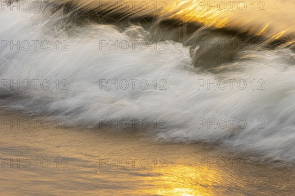 Waves at sunset on the west beach of Fischland-Darß-Zingst, Baltic Sea, Ahrenshoop, Mecklenburg-Western Pomerania, Germany