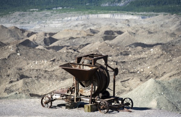 Old rusted moving mill for rock in front of mountain landscape with Kennicott Glacier, Historic Kennecott Copper Mine, National Historic Landmark, Wrangell St. Elias National Park, Alaska, USA