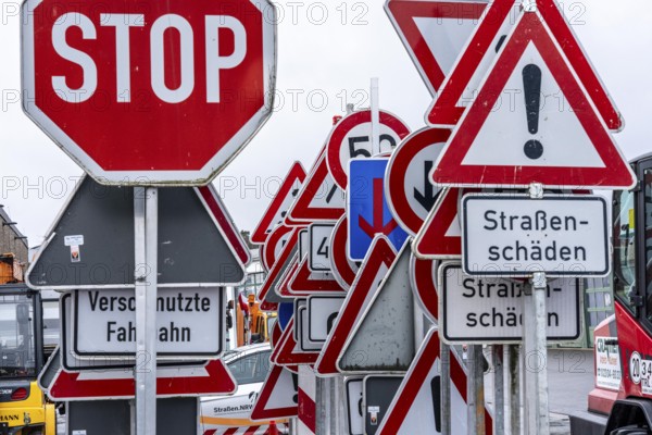 Storage for traffic signs in the yard of a road maintenance department, various signs with commandments and prohibitions, information about dangers, road traffic