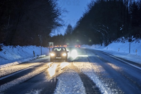 Country road with snow and slush Bergisches Land, near Marienheide, North Rhine-Westphalia, Germany