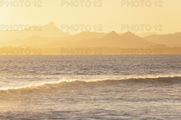 Evening light at Cape Byron with view to Mount Warning and sunlit hinterland, New South Wales, Australia