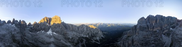 Aerial view, alpine panorama, Cima Tosa and rocky peaks at sunrise with alpine glow, picturesque mountain landscape, Brenta Dolomites, Trentino, Italy