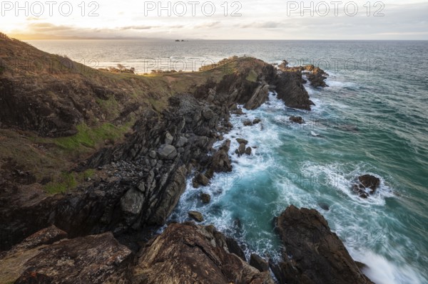 Sunset with wide view over the east coast at Cape Byron, New South Wales, Australia
