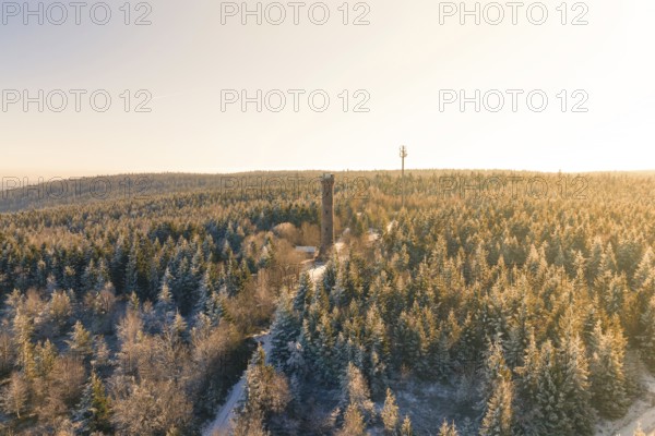 A wide view of a snow-covered forest with a tower on the horizon, Holohturm, Gernsbach, Rastatt district, Germany