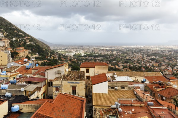 View of red tile roofs of the city of Monreale, Palermo on the horizon, Monreale, Sicily, southern Italy, Italy