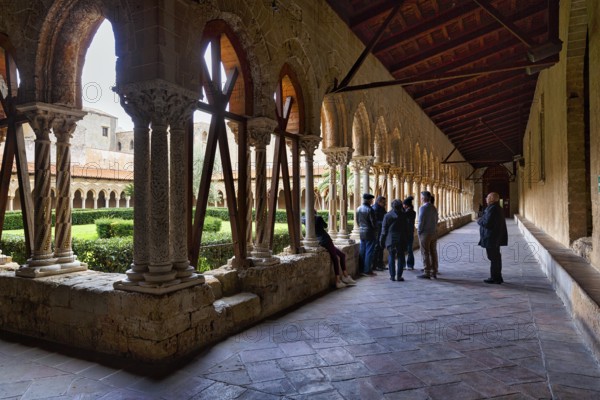 Famous cloister of the Benedictine monastery, tourist group, Cathedral of Monreale, Santa Maria Nuova, Monreale, Sicily, southern Italy, Italy