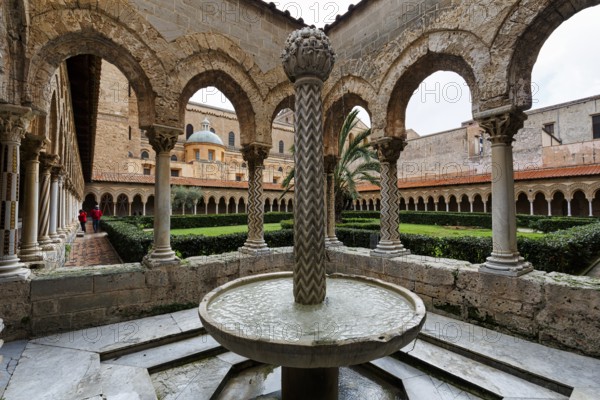 Famous Benedictine monastery cloister, decorated columns and fountains, Cathedral of Monreale, Santa Maria Nuova, Monreale, Sicily, Southern Italy, Italy