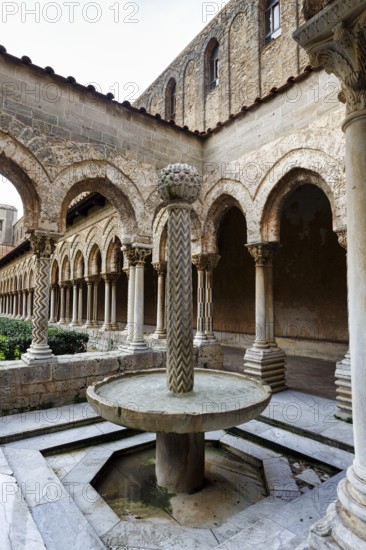 Famous Benedictine monastery cloister, decorated columns and fountains, Cathedral of Monreale, Santa Maria Nuova, Monreale, Sicily, Southern Italy, Italy