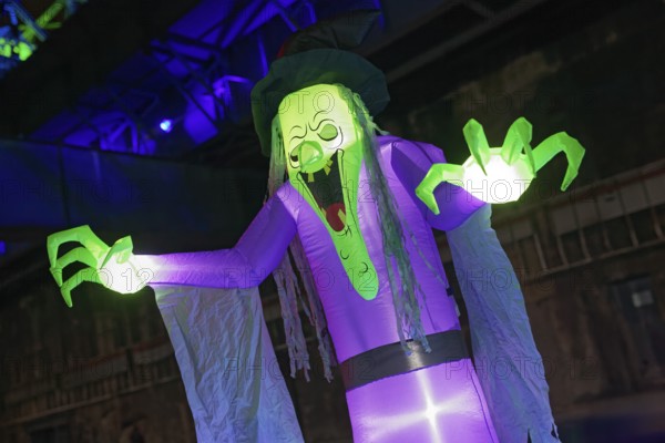 Illuminated scary figure at Halloween Run, night run in the Duisburg-Nord Landscape Park, Duisburg, Germany, North Rhine-Westphalia, Germany
