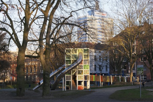 Children's playground with colorful climbing tower and slides, Immanuel-Kant-Park, Duisburg, North Rhine-Westphalia, Germany