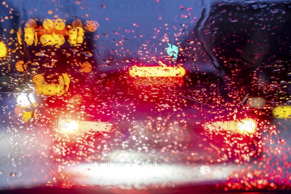 Driving in winter, in snow, rain, rear lights, brake lights