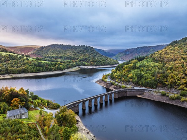Autumn over Garreg Ddu Dam from a drone, Elan Valley, Caban-Coch Reservoir, Rhayader, Wales, UK