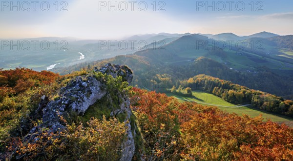 View of an autumnal forest from the Gisliflue, behind the Jura foothills with Wasserfluh and Strihen, Talheim, Canton, Aargau, Switzerland