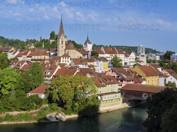View of the old town with the parish church of the Assumption of Mary, in the back the Baden City Tower, on the right the covered wooden bridge that crosses the Limmat River, Baden, Canton, Aargau, Switzerland