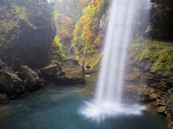 Waterfall mountain list in autumn-colored surroundings, Linthal, Klausenpass, Canton of Glarus, Switzerland