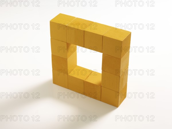 12 yellow wooden cubes against a white background