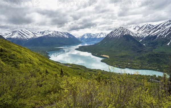 View of snowy mountains and turquoise lake Kenai Lake, Slaughter Ridge Trail, Cooper Landing, Kenai Peninsula, Alaska, USA