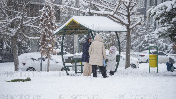In Gaziantep, Turkey, on December 31, 2025, children and families enjoy winter activities as they play on snow-covered areas and slide on icy hills, creating a lively atmosphere across the city during the final day of the year, Gaziantep, Gaziantep, Turkey