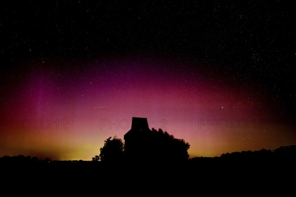 Colourful polar lights over the EXPO observatory in front of a starry night, EXPO Observatory, Oberholsten, Melle, Lower Saxony, Germany