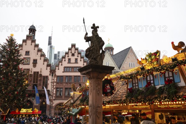 December 22, 2025, Frankfurt Christmas Market on Roemerberg at twilight. Traditional wooden stalls and festive lights shine in the historic square, Frankfurt, Hesse, Germany