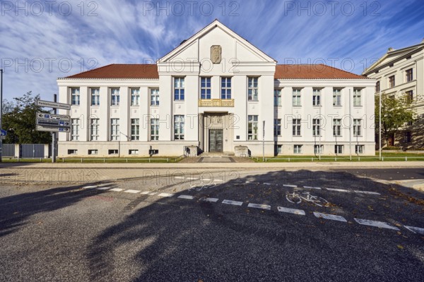 State archive, historic building, architect Paul Ehmig, central risalit, hipped roof, façade with windows and entrance, cycle path, blue sky, cirrus clouds, Graf-Schack-Allee, Schwerin, state capital, district-free city, Mecklenburg-Western Pomerania, Germany