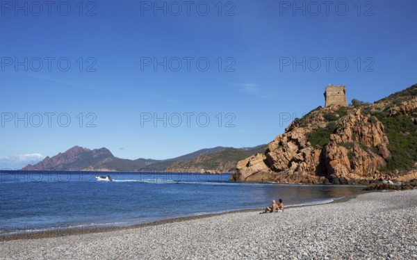 Genoese tower on the pebble beach of Porto, Ota, west coast of Corsica, Corse-du-Sud, Corsica, France