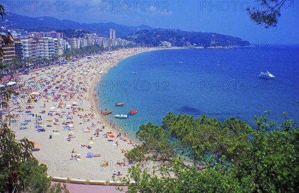 Skyscrapers, people, boats, trees, Lloret de Mar beach on the Costa de Maresme near Barcelona, Spain, June 1999, vintage, retro, old, historic