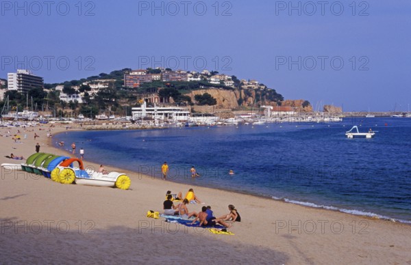 Houses, people, Sant Feliu de Guixols beach on the Costa Brava, Spain, June 1999, vintage, retro, old, historic