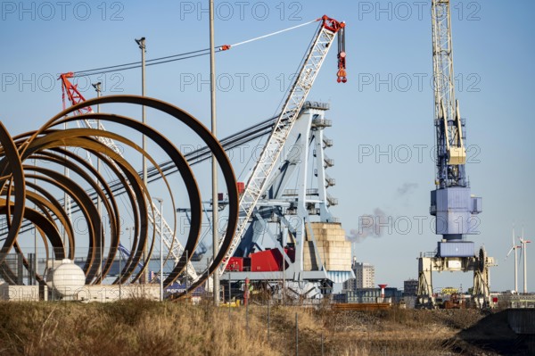 Parts for foundations for offshore wind turbines Monopiles and Single Piece Foundations, in the Steelwind satellite warehouse in Nordenham, at the mouth of the Weser, Lower Saxony, Germany