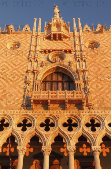 Sun rays at sunrise on the façade of the Doge's Palace, Venice, Veneto, Italy