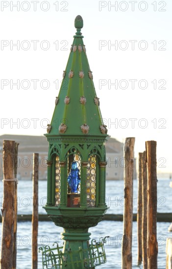 Lamp with portrait of Mary at a gondola station, Venice, Veneto, Italy