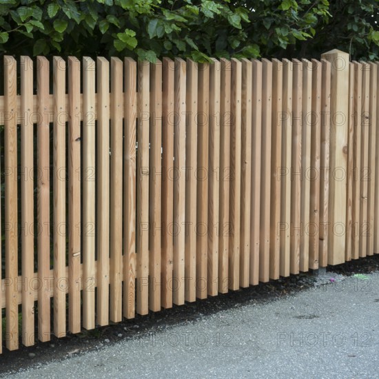 Wooden fence on the side of the road, vertical slats, town of Tegernsee, Upper Bavaria, Bavaria, Germany