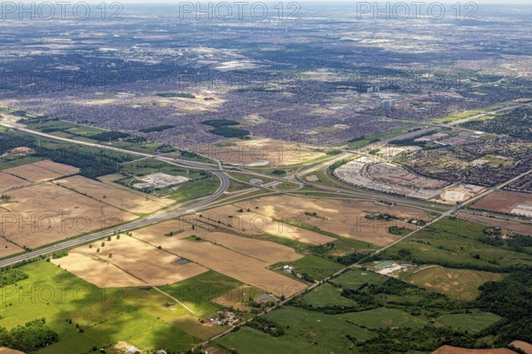 The border between urban and agricultural areas is clearly visible from the air, as seen from an airplane of the suburbs of Toronto in Canada