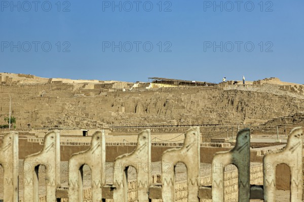 Historic sites in a desert landscape under clear blue skies, the archeological city of Huaca Pucllana near Lima in Peru