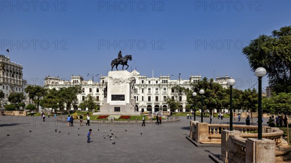 Impressive equestrian monument in the middle of an open square with colonial buildings, Downtown Lima in Peru