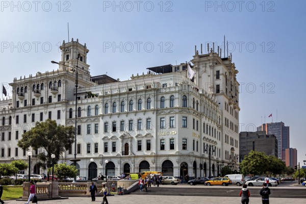 Beautiful colonial-style corner building with lively city life, Downtown Lima in Peru