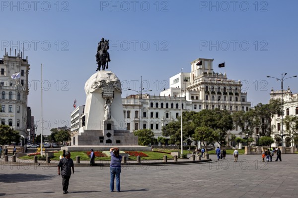 Equestrian monument on a large square in front of imposing historic buildings, Downtown Lima in Peru