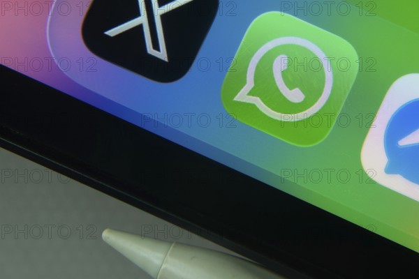 16 Nov 2025- Dhaka, Bangladesh: WhatsApp and other app icons with a digital pen on a iPad screen