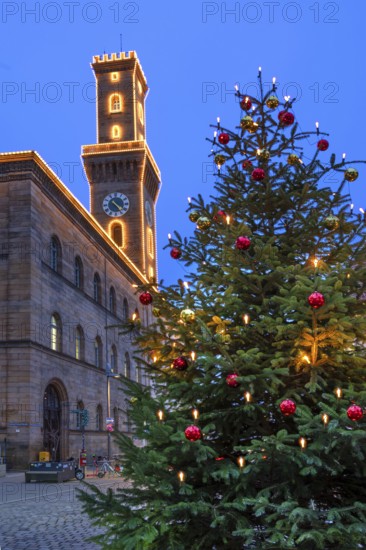 Fürth Town Hall in evening lighting, the tower is imitated the tower of the Palazzo Vecchio in Florence, on the right a decorated Christmas tree, blue evening sky, Fürth, Middle Franconia, Bavaria, Germany