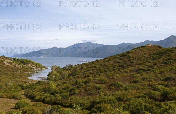 Sailing boat in the Mediterranean, Gulf of Saint-Florent, in front of the Agriates Desert or Agriates Desert, Haute-Corse, Corsica