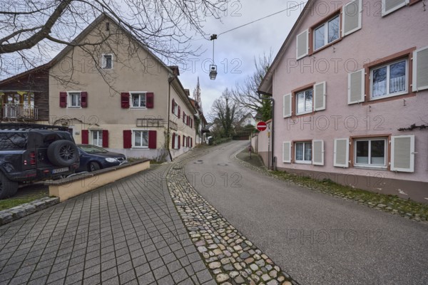 Residential buildings, apartment buildings, houses, general architecture, lantern, cars, bare winter trees, cloudy, diffuse light, alleyway St.-Johannesgasse, Staufen im Breisgau, Black Forest, Breisgau-Hochschwarzwald district, Baden-Württemberg, Germany