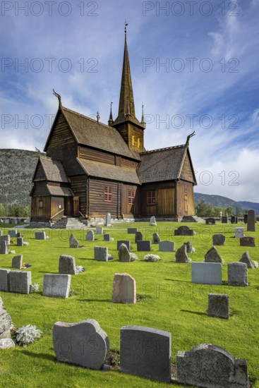Lom Stave Church (Lom stavkyrkje) with cemetery in the foreground, Lom, Norway