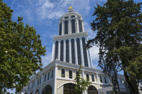 An imposing tower rises among trees under a clear blue sky, Sheraton Hotel, Batumi, Black Sea, Ajara Region, Adjara, Autonomous Republic, Georgia