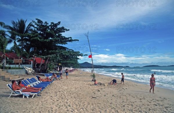 People, deckchairs, Chaweng Beach on Ko Samui, Thailand, December 2002, vintage, retro, old, historic