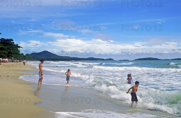 People, children, sea, surf, Chaweng Beach on Ko Samui, Thailand, December 2002, vintage, retro, old, historic
