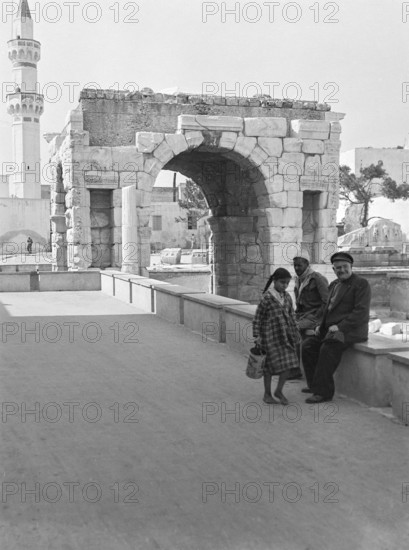 Roman arch of Marcus Aurelius Tripoli, Libya, North Africa 1956 with mosque minaret in background